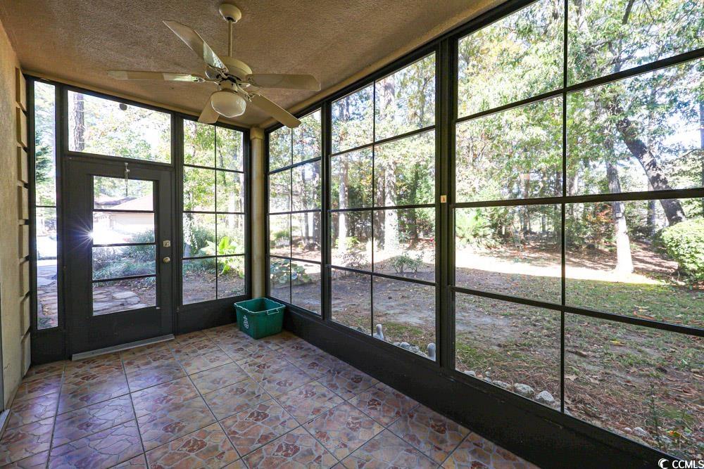 401 Pipers Lane, Unit 401 Myrtle Beach, SC 29575 - Photo 35 of 40 Unfurnished sunroom featuring ceiling fan