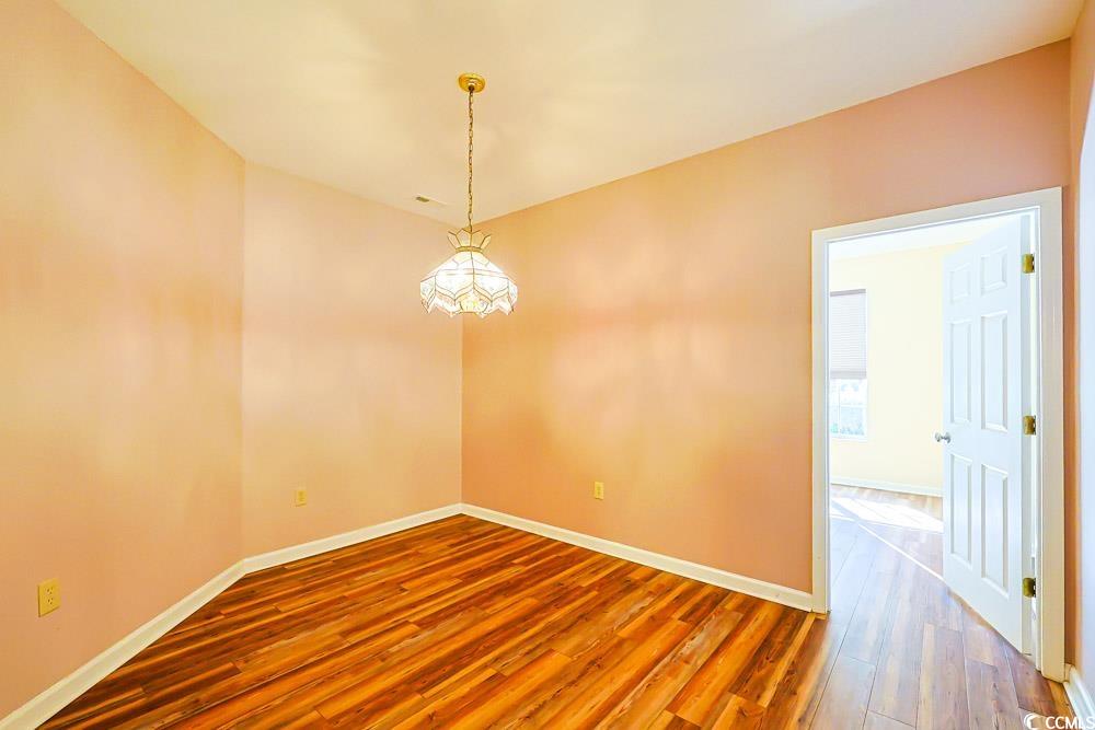 401 Pipers Lane, Unit 401 Myrtle Beach, SC 29575 - Photo 7 of 40 Unfurnished room featuring wood finished floors