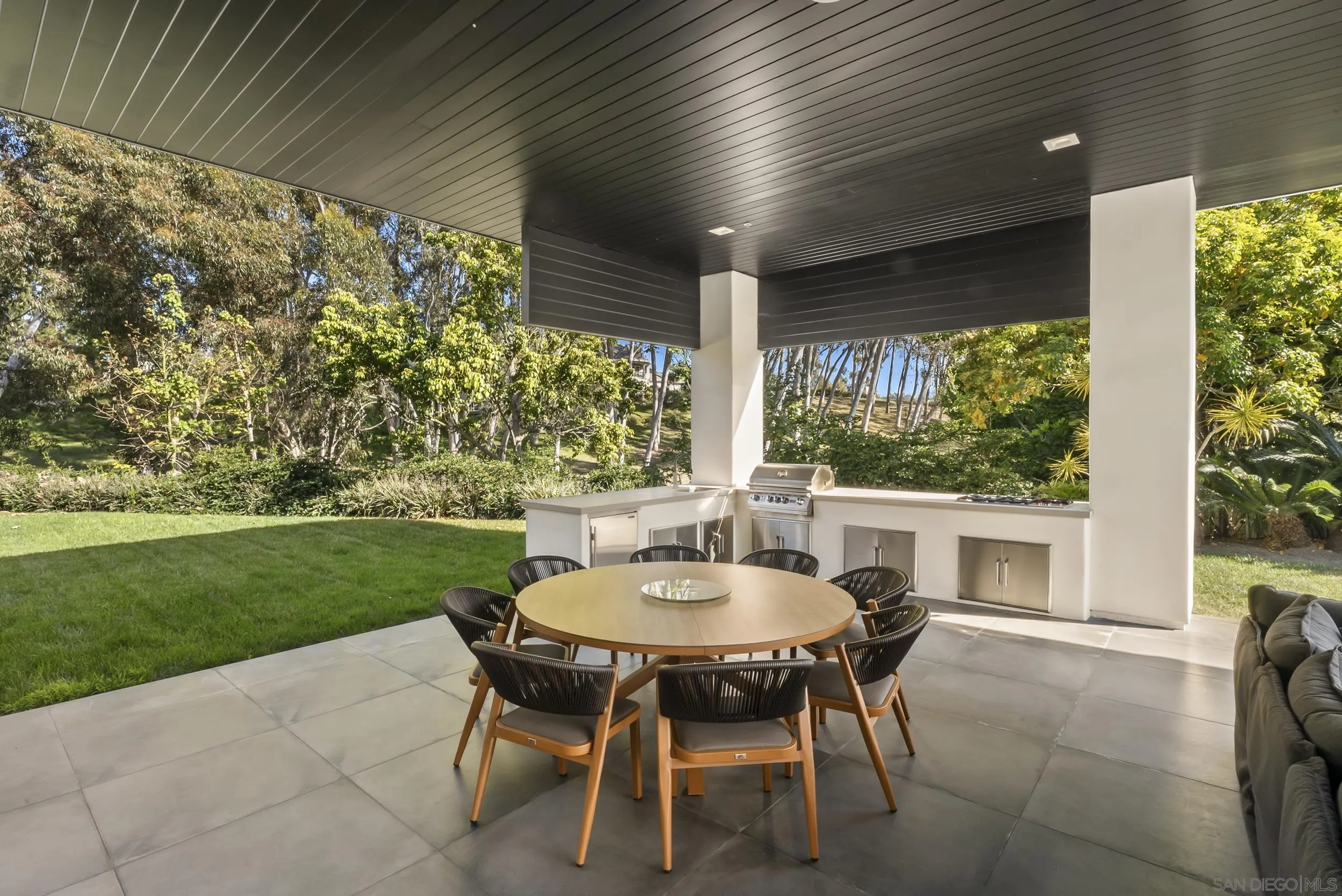 6850 Avenida De La Ronda Rancho Santa Fe, CA 92067 - Photo 33 of 40 a view of a patio with a table and chairs