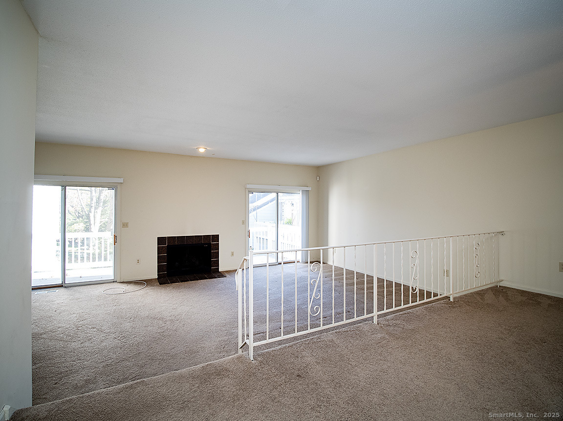 3989 Park Avenue, Unit 3989 Fairfield, CT 06825 - Photo 11 of 37 a view of an empty room with a window