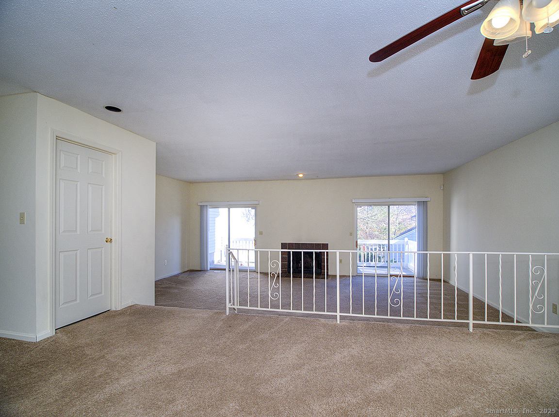 3989 Park Avenue, Unit 3989 Fairfield, CT 06825 - Photo 12 of 37 an empty room with windows and pillars in it