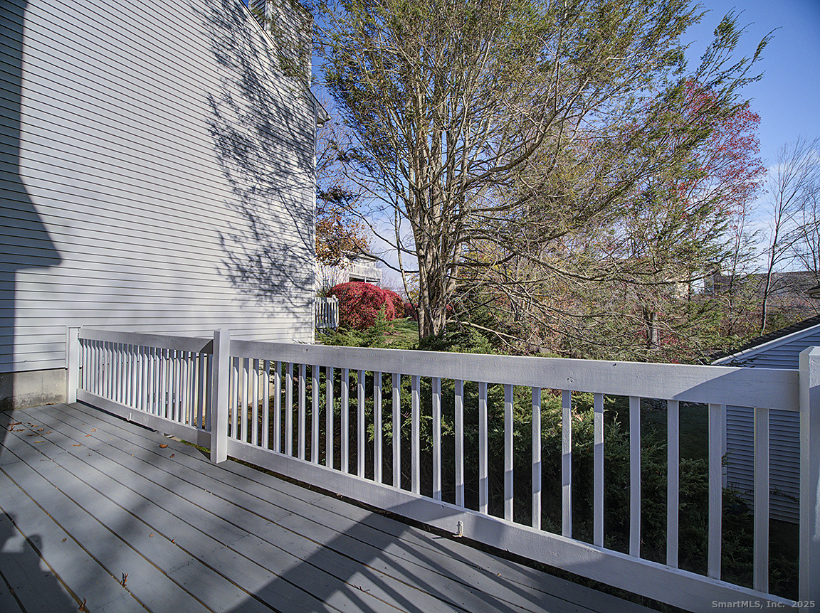 3989 Park Avenue, Unit 3989 Fairfield, CT 06825 - Photo 15 of 37 a view of a wooden balcony