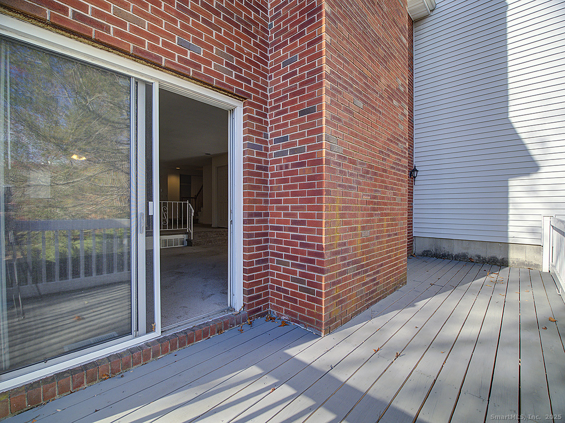 3989 Park Avenue, Unit 3989 Fairfield, CT 06825 - Photo 16 of 37 a view of outdoor space with wooden floor and window