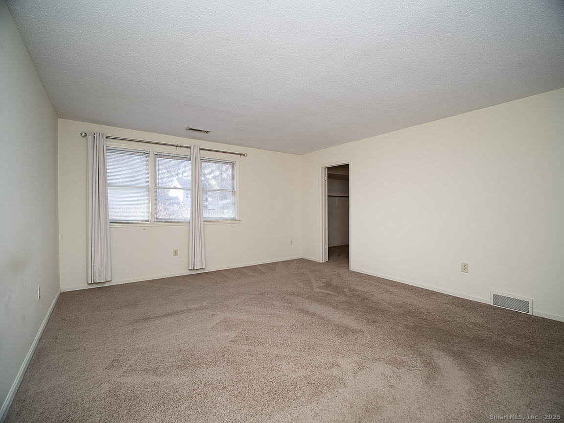 3989 Park Avenue, Unit 3989 Fairfield, CT 06825 - Photo 25 of 37 an empty room with windows