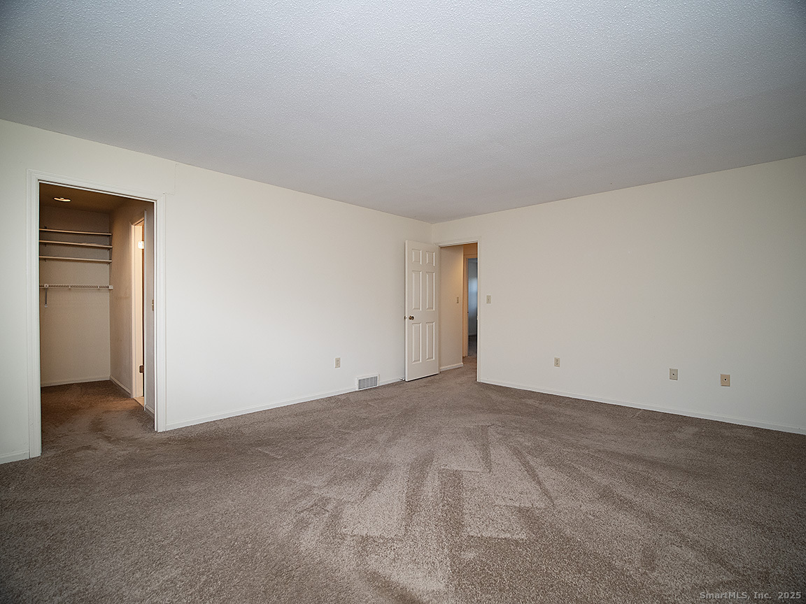 3989 Park Avenue, Unit 3989 Fairfield, CT 06825 - Photo 26 of 37 an empty room with closet area