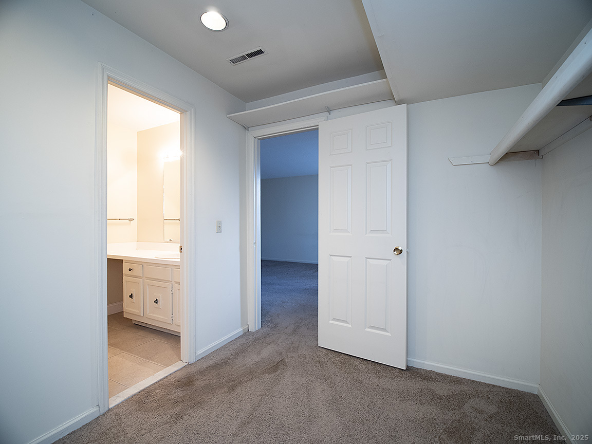 3989 Park Avenue, Unit 3989 Fairfield, CT 06825 - Photo 30 of 37 an empty room with a window and a en suite bathroom