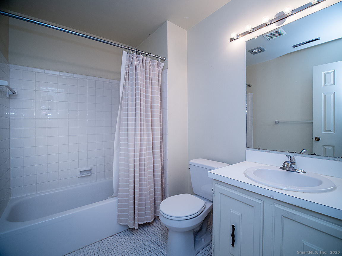 3989 Park Avenue, Unit 3989 Fairfield, CT 06825 - Photo 32 of 37 a bathroom with a sink toilet and shower