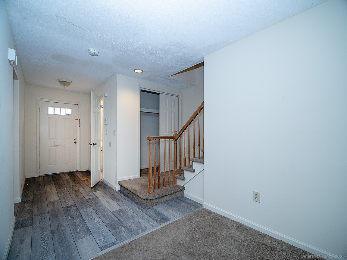3989 Park Avenue, Unit 3989 Fairfield, CT 06825 - Photo 8 of 37 a view of entryway with wooden floor