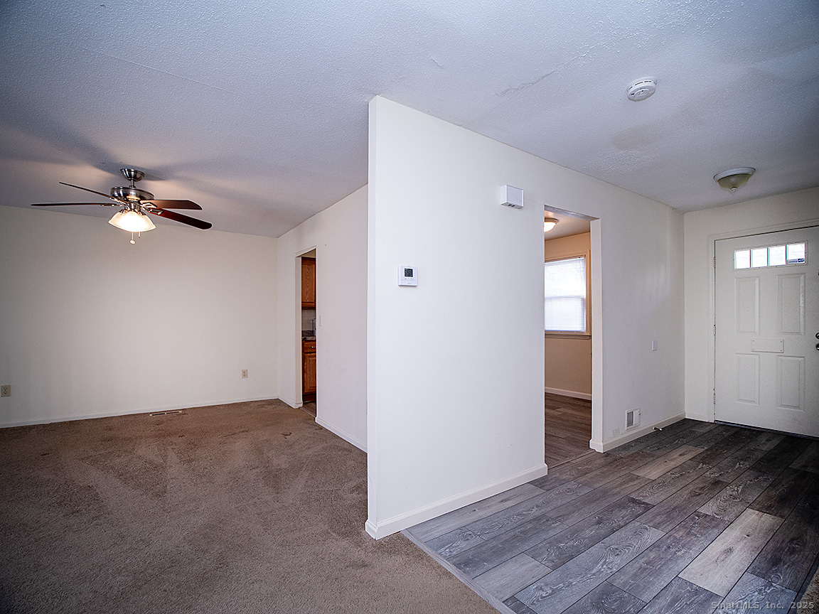 3989 Park Avenue, Unit 3989 Fairfield, CT 06825 - Photo 9 of 37 wooden floor in an empty room with a window