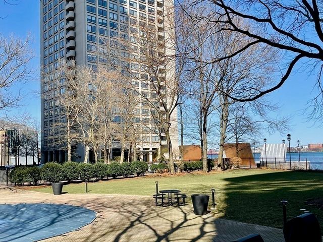 a view of swimming pool with outdoor seating