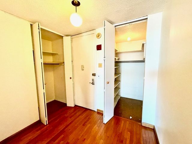 a kitchen with a sink a refrigerator and cabinets