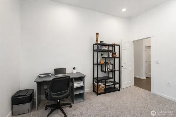 a bedroom with a bed and a mirror
