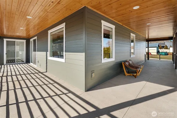 a view of swimming pool with an outdoor seating