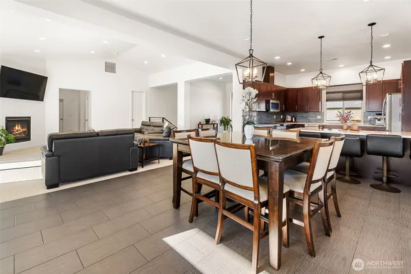 a kitchen with stainless steel appliances kitchen island granite countertop a sink and a granite counter tops