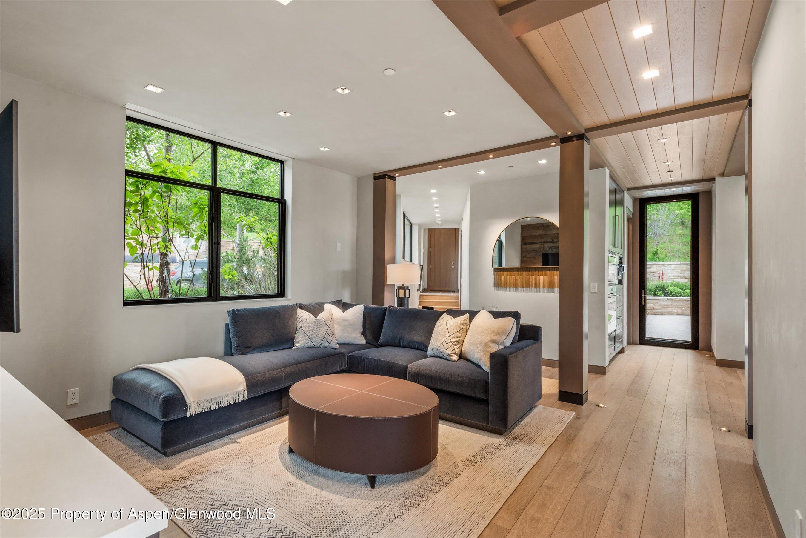 31 Aspen Valley Ranch Road Woody Creek, CO 81656 - Photo 13 of 52 a living room with furniture and a large window