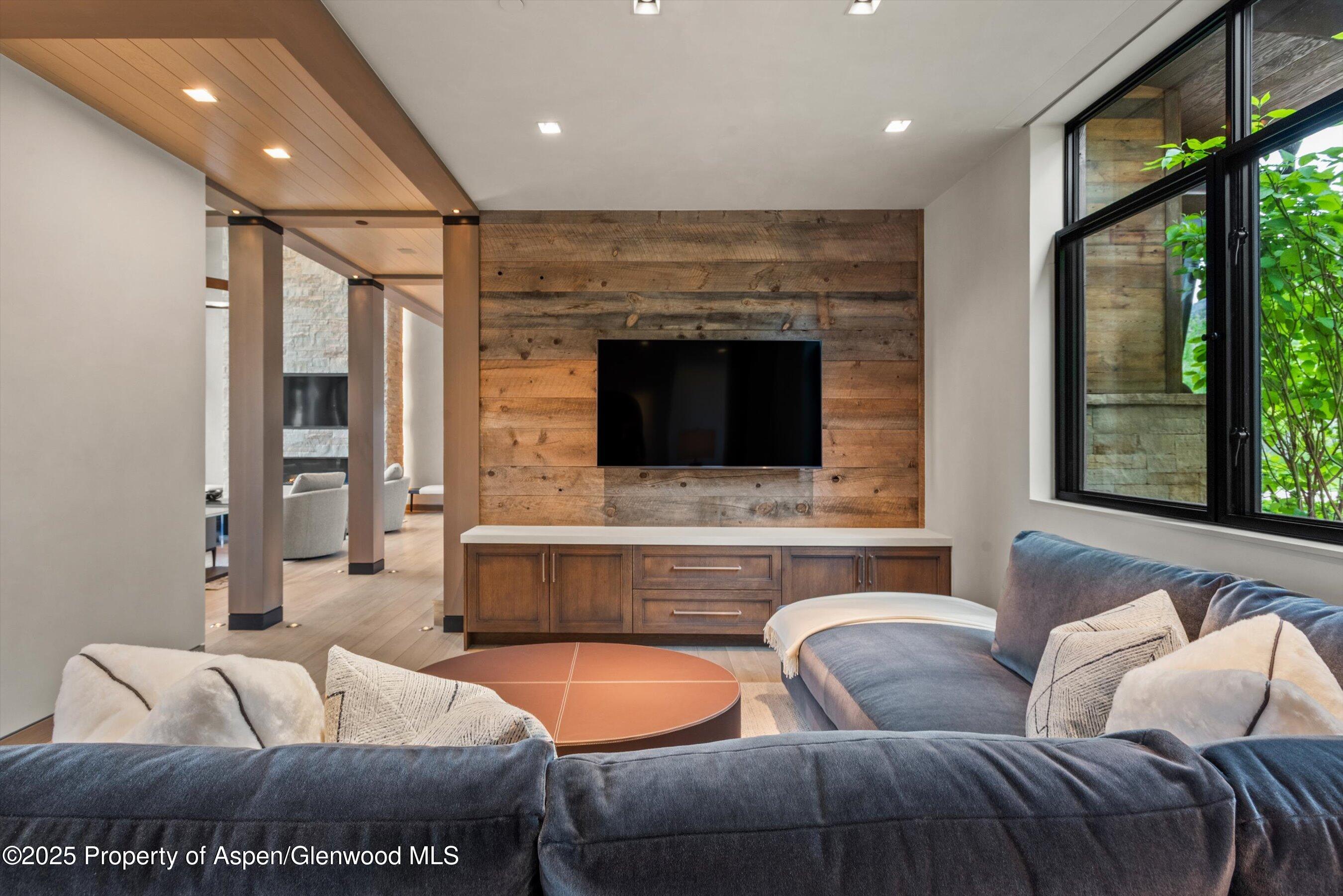 31 Aspen Valley Ranch Road Woody Creek, CO 81656 - Photo 14 of 52 a living room with furniture and a flat screen tv