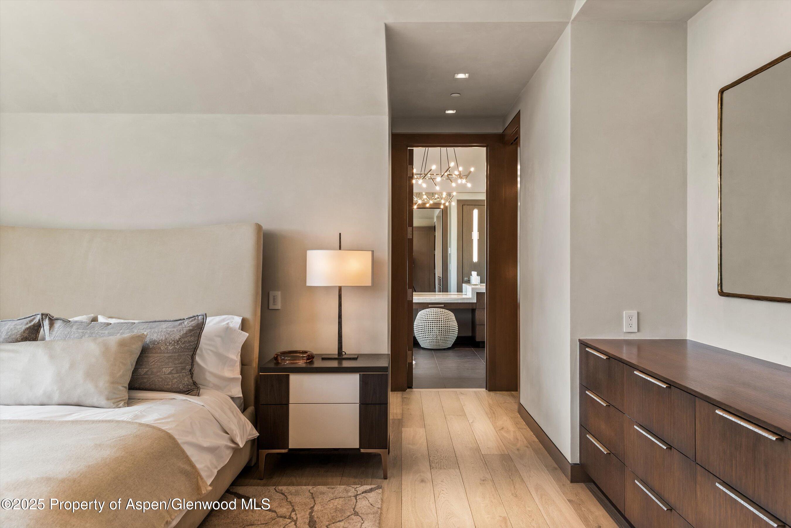 31 Aspen Valley Ranch Road Woody Creek, CO 81656 - Photo 19 of 52 a bed room with a bed and a night stand