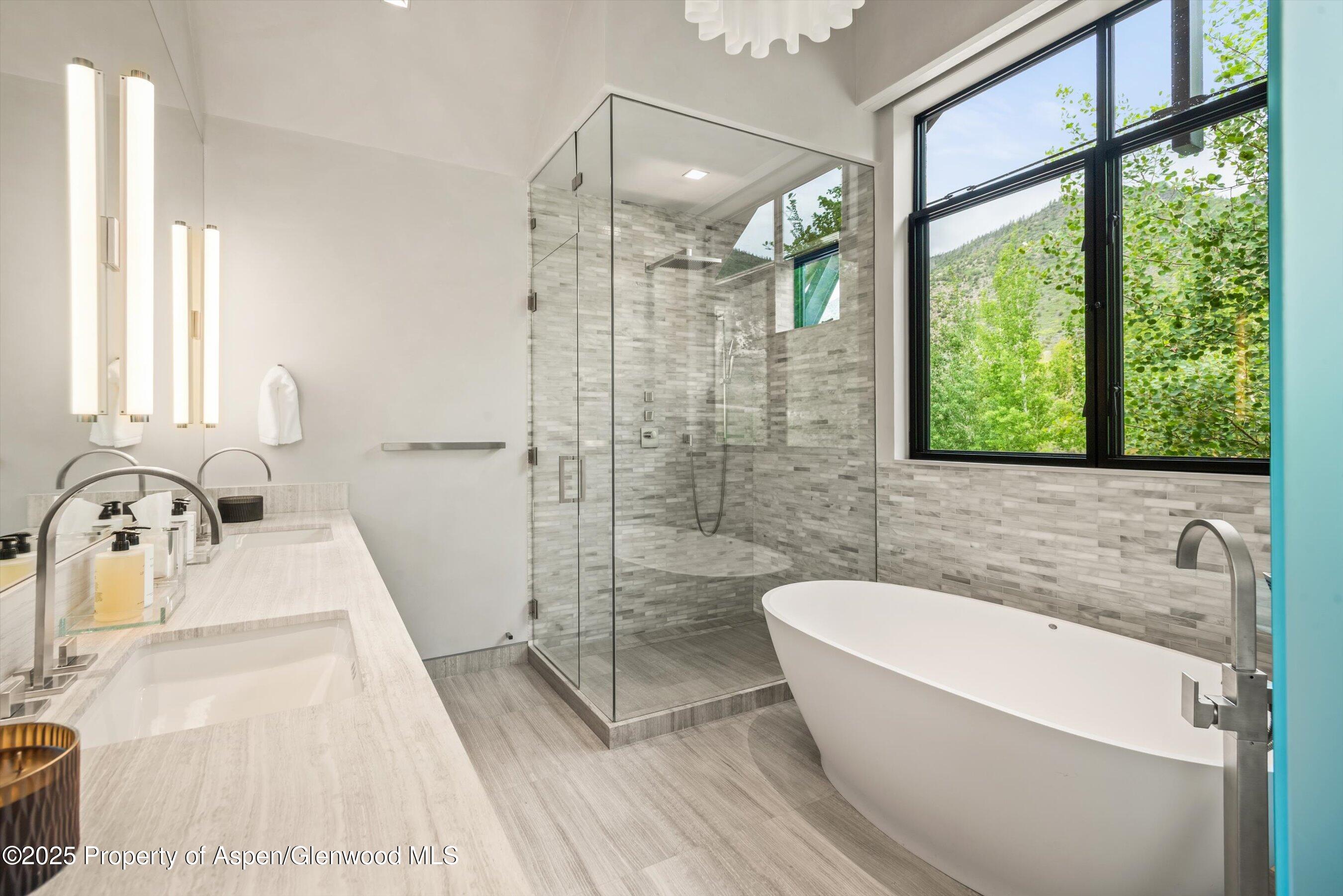 31 Aspen Valley Ranch Road Woody Creek, CO 81656 - Photo 33 of 52 a bathroom with a bathtub and a sink
