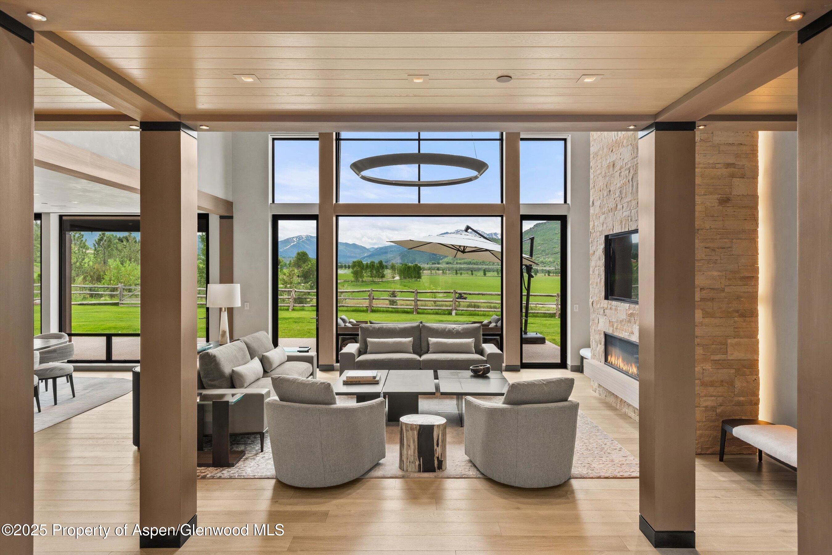 31 Aspen Valley Ranch Road Woody Creek, CO 81656 - Photo 4 of 52 a living room with furniture and a large window