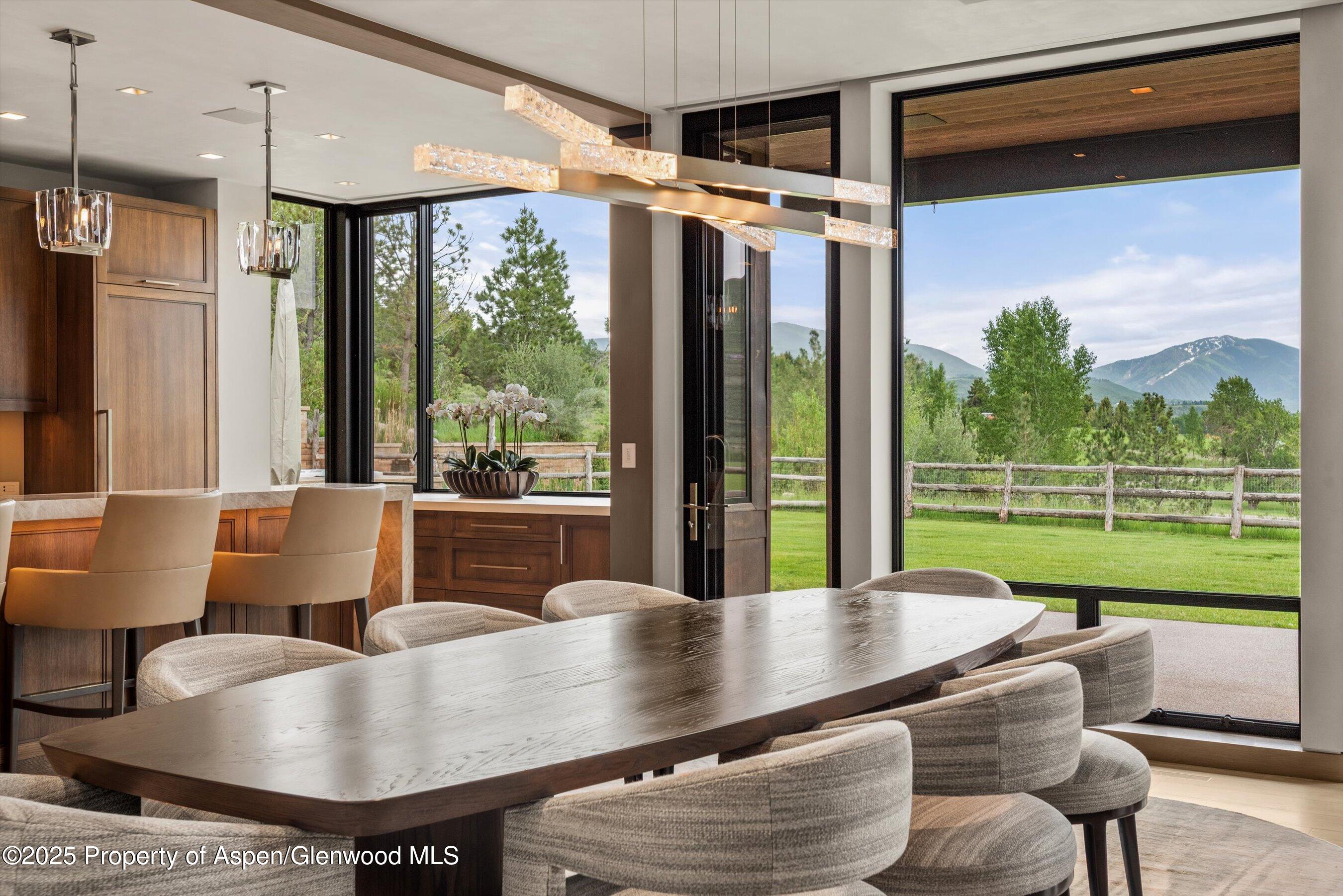 31 Aspen Valley Ranch Road Woody Creek, CO 81656 - Photo 8 of 52 a living room with furniture and a large window