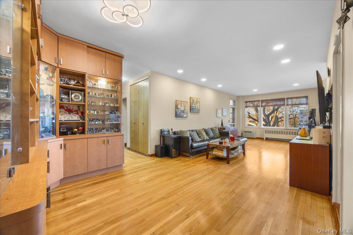 1015 Old Boston Post Road, Unit 2C Mamaroneck, NY 10543 - Photo 2 of 26 Living area with light wood finished floors, recessed lighting, and radiator