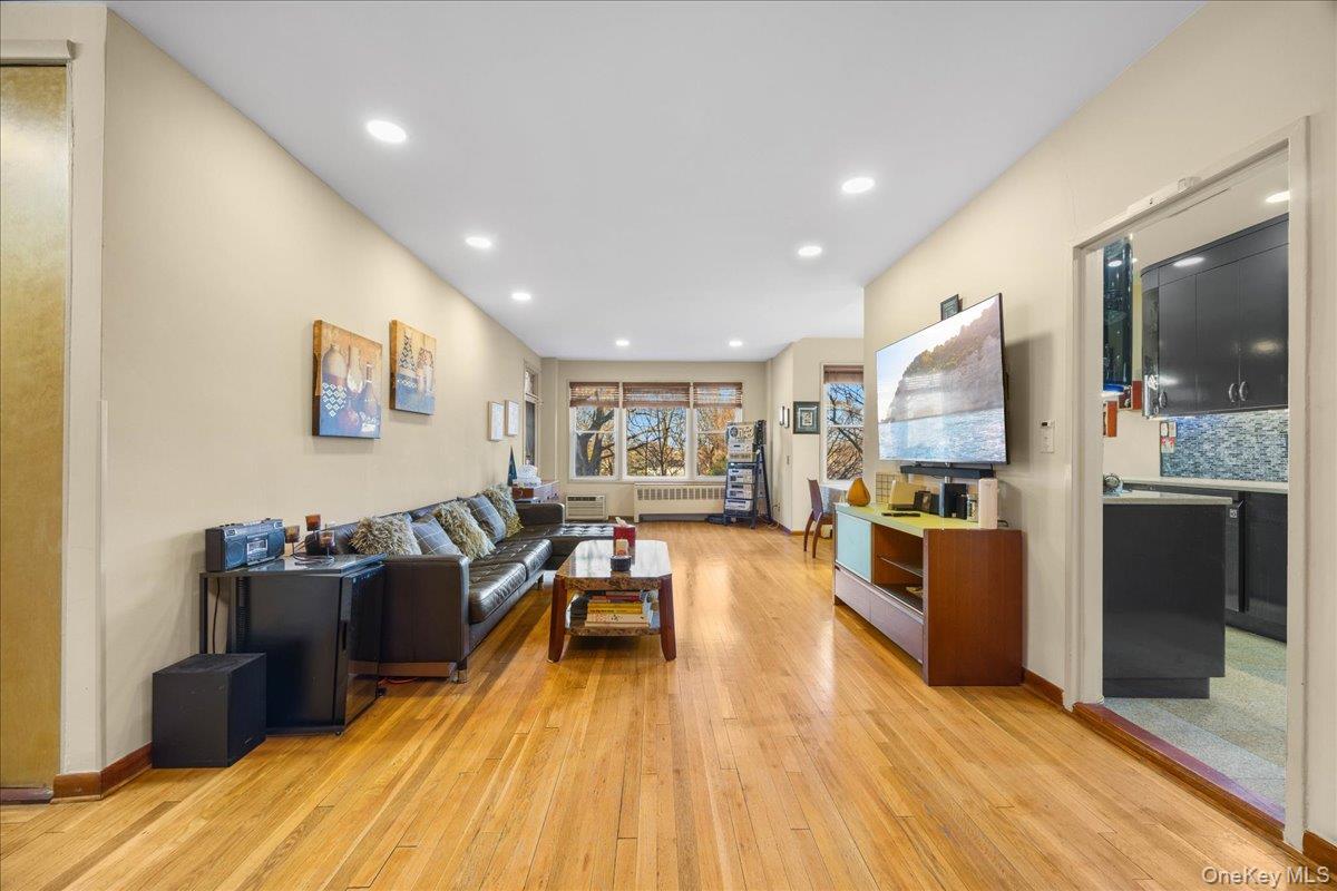 1015 Old Boston Post Road, Unit 2C Mamaroneck, NY 10543 - Photo 3 of 26 Living area with light wood finished floors, recessed lighting, and radiator