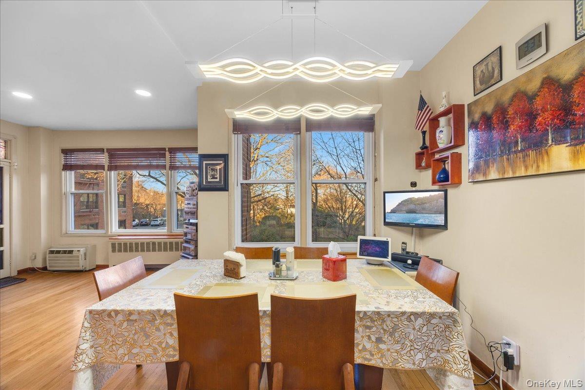 1015 Old Boston Post Road, Unit 2C Mamaroneck, NY 10543 - Photo 8 of 26 Dining area featuring radiator heating unit and light wood finished floors