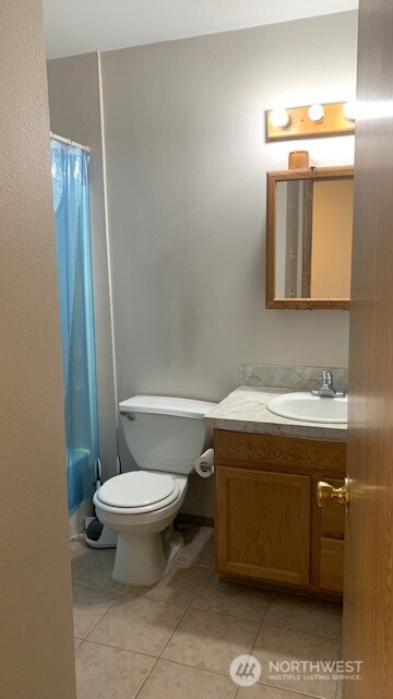 1939 South I Street, Unit B Tacoma, WA 98405 - Photo 5 of 10 a bathroom with a sink toilet and shower