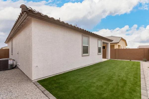 a backyard of a house with lots of green space