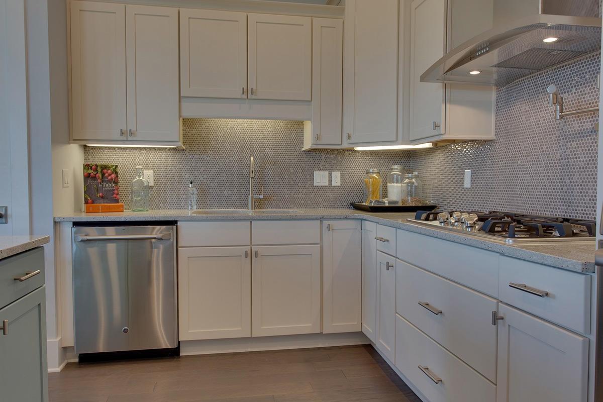 162 Clipper Street Inlet Beach, FL 32461 - Photo 4 of 9 a kitchen with white cabinets and white appliances