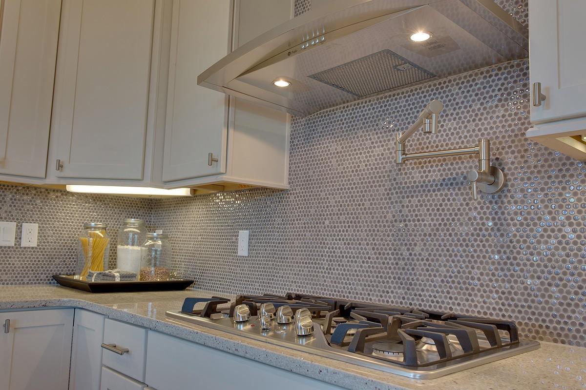 162 Clipper Street Inlet Beach, FL 32461 - Photo 5 of 9 a kitchen with a stove a sink and cabinets