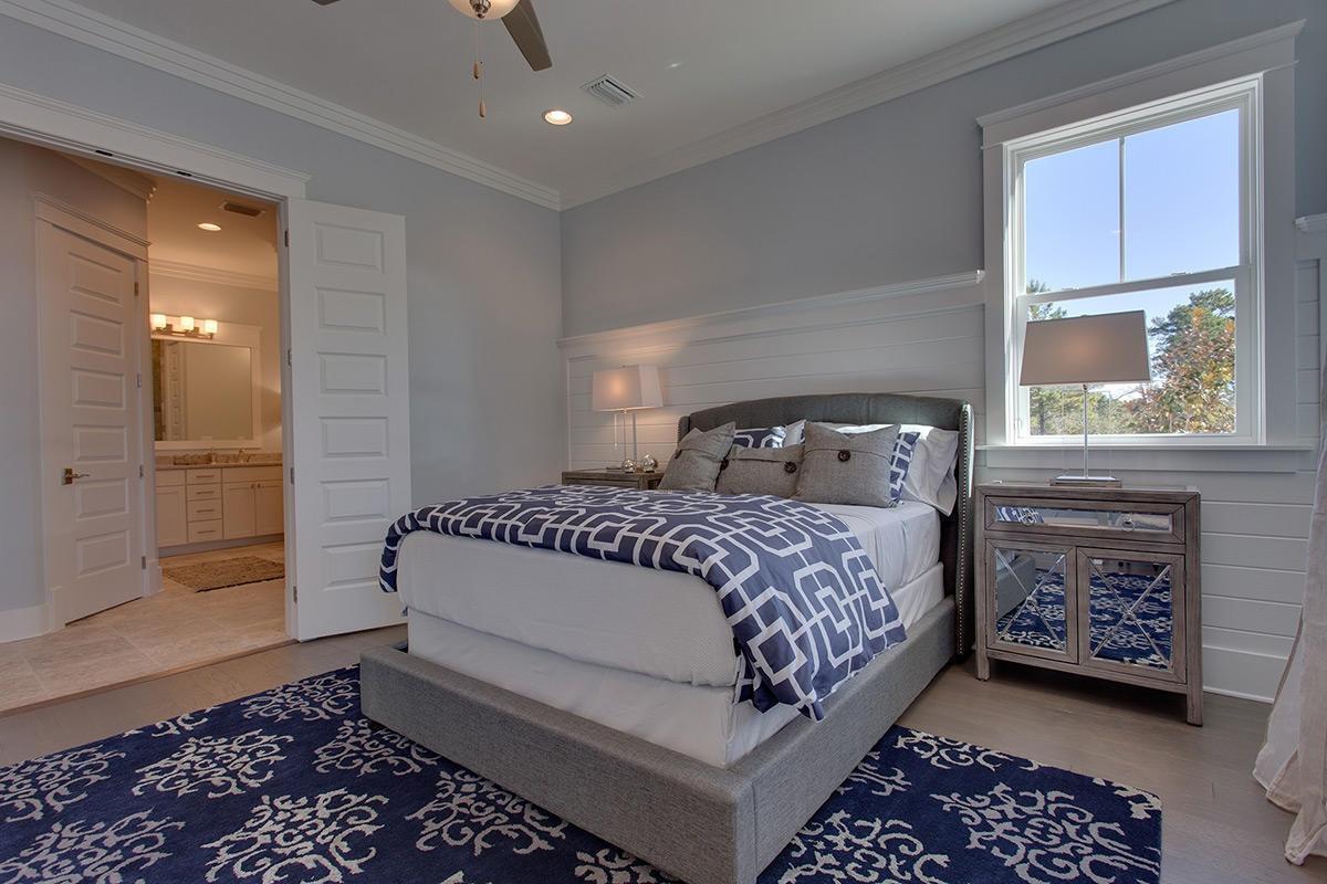 162 Clipper Street Inlet Beach, FL 32461 - Photo 7 of 9 a bedroom with a bed and a window