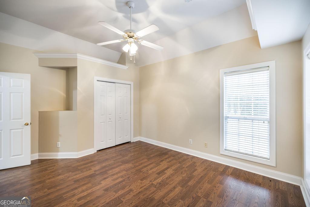 209 Trellis Walk Centerville, GA 31028 - Photo 11 of 38 a view of an empty room with wooden floor and a window