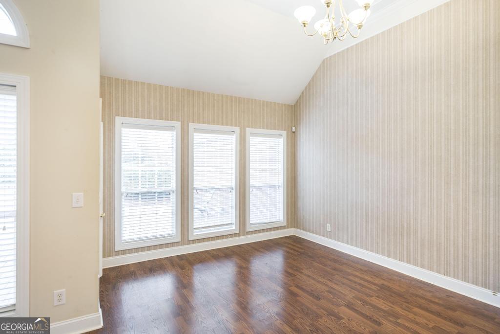 209 Trellis Walk Centerville, GA 31028 - Photo 17 of 38 an empty room with wooden floor and windows