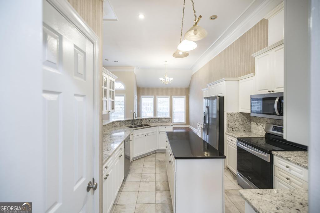 209 Trellis Walk Centerville, GA 31028 - Photo 22 of 38 a large white kitchen with a large window