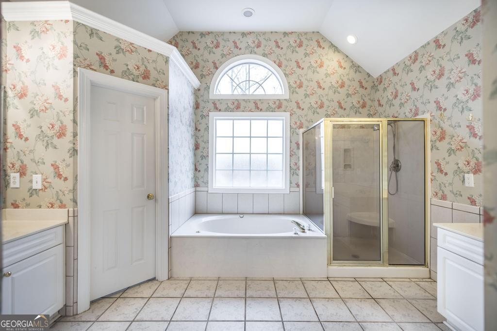 209 Trellis Walk Centerville, GA 31028 - Photo 25 of 38 a bathroom with a bathtub and a shower
