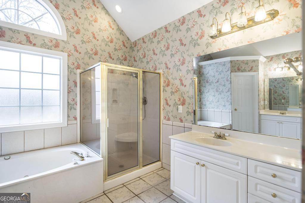 209 Trellis Walk Centerville, GA 31028 - Photo 27 of 38 a spacious bathroom with a shower a sink and a large mirror