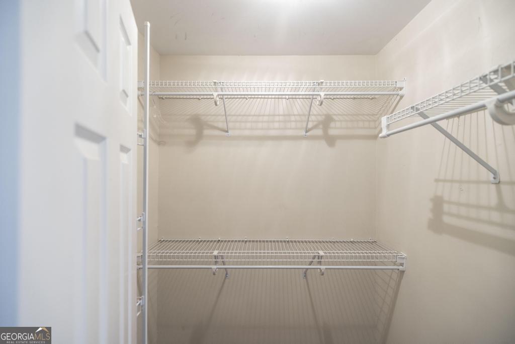 209 Trellis Walk Centerville, GA 31028 - Photo 28 of 38 a view of a room with racks on the wall