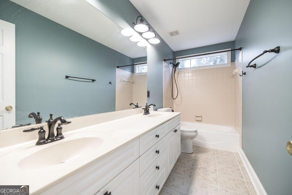 209 Trellis Walk Centerville, GA 31028 - Photo 30 of 38 a bathroom with a double vanity sink mirror double and shower