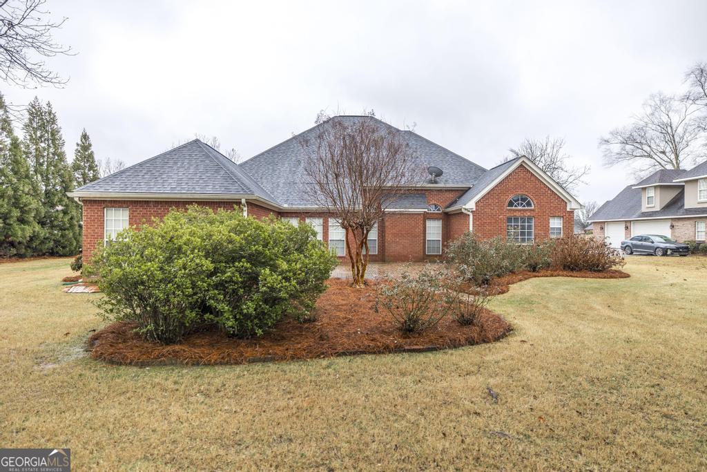 209 Trellis Walk Centerville, GA 31028 - Photo 34 of 38 a front view of house with yard and trees around