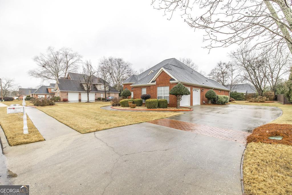 209 Trellis Walk Centerville, GA 31028 - Photo 4 of 38 a view of house with snow on the road