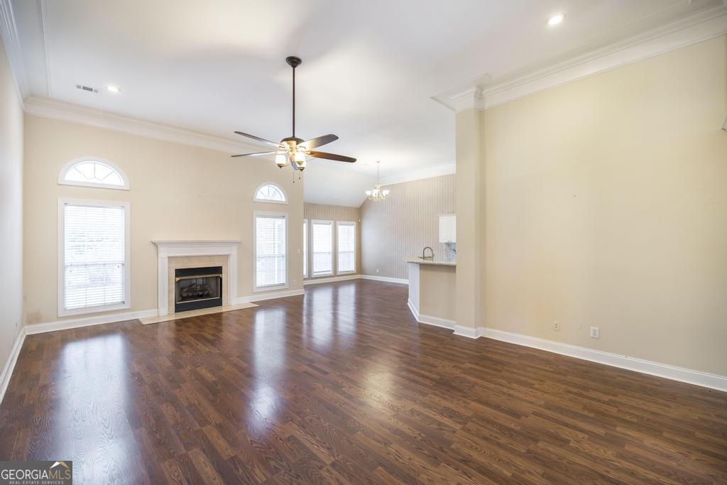 209 Trellis Walk Centerville, GA 31028 - Photo 9 of 38 a view of empty room with wooden floor and fireplace