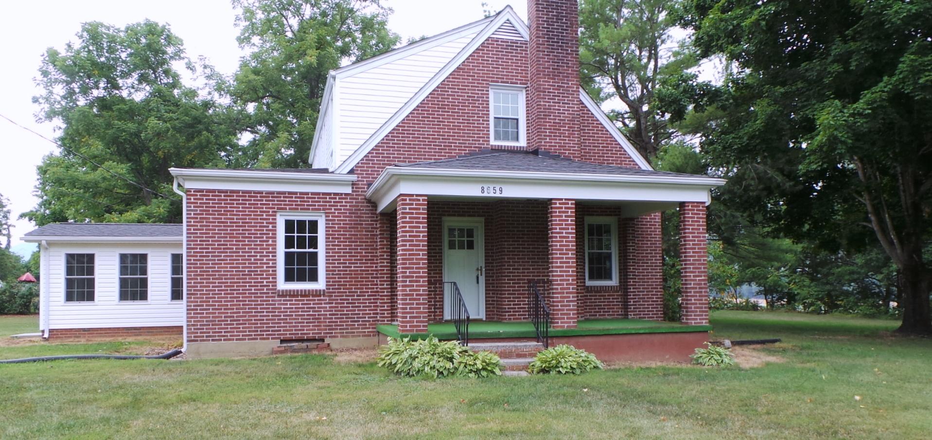 8659 Roanoke Road Elliston, VA 24087 - Photo 2 of 32 a front view of a house with a yard