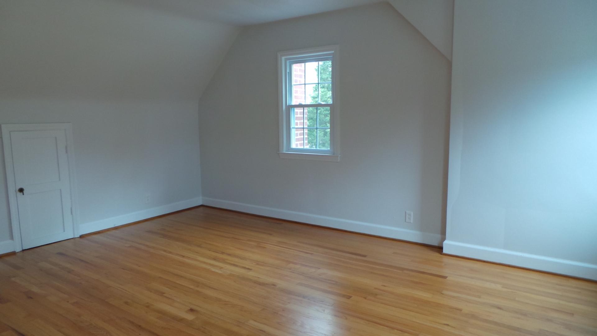 8659 Roanoke Road Elliston, VA 24087 - Photo 12 of 32 an empty room with wooden floor and windows