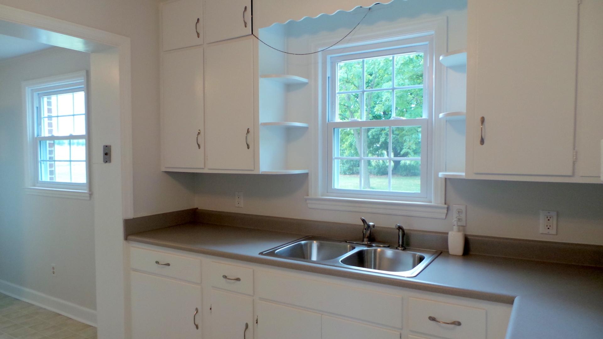 8659 Roanoke Road Elliston, VA 24087 - Photo 18 of 32 a kitchen with a sink and cabinets