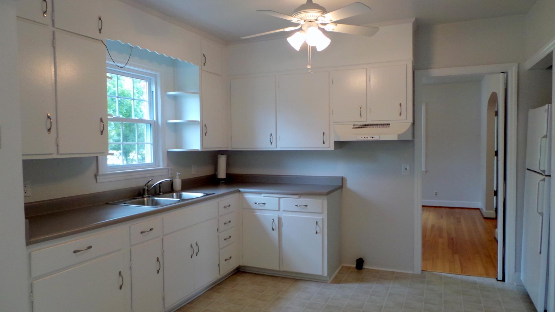8659 Roanoke Road Elliston, VA 24087 - Photo 19 of 32 a kitchen with cabinets appliances and a window