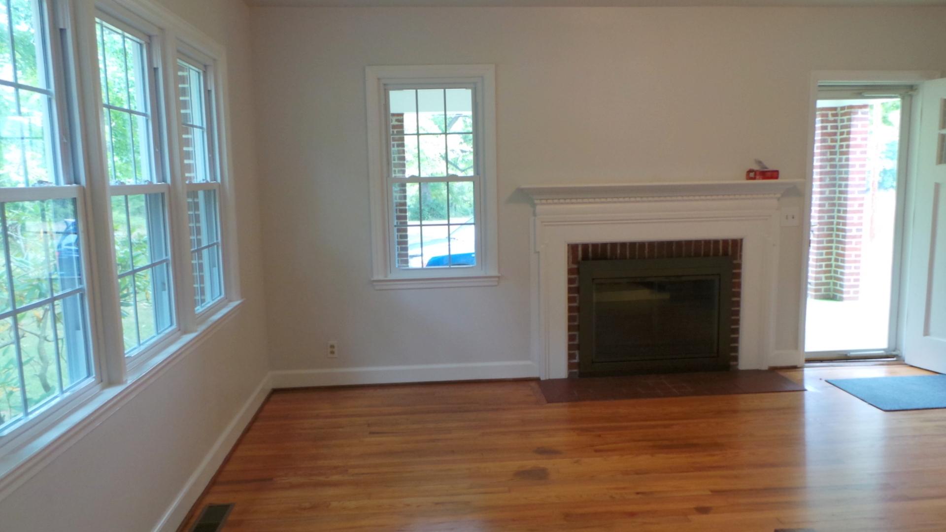 8659 Roanoke Road Elliston, VA 24087 - Photo 22 of 32 a view of an empty room with wooden floor and a window