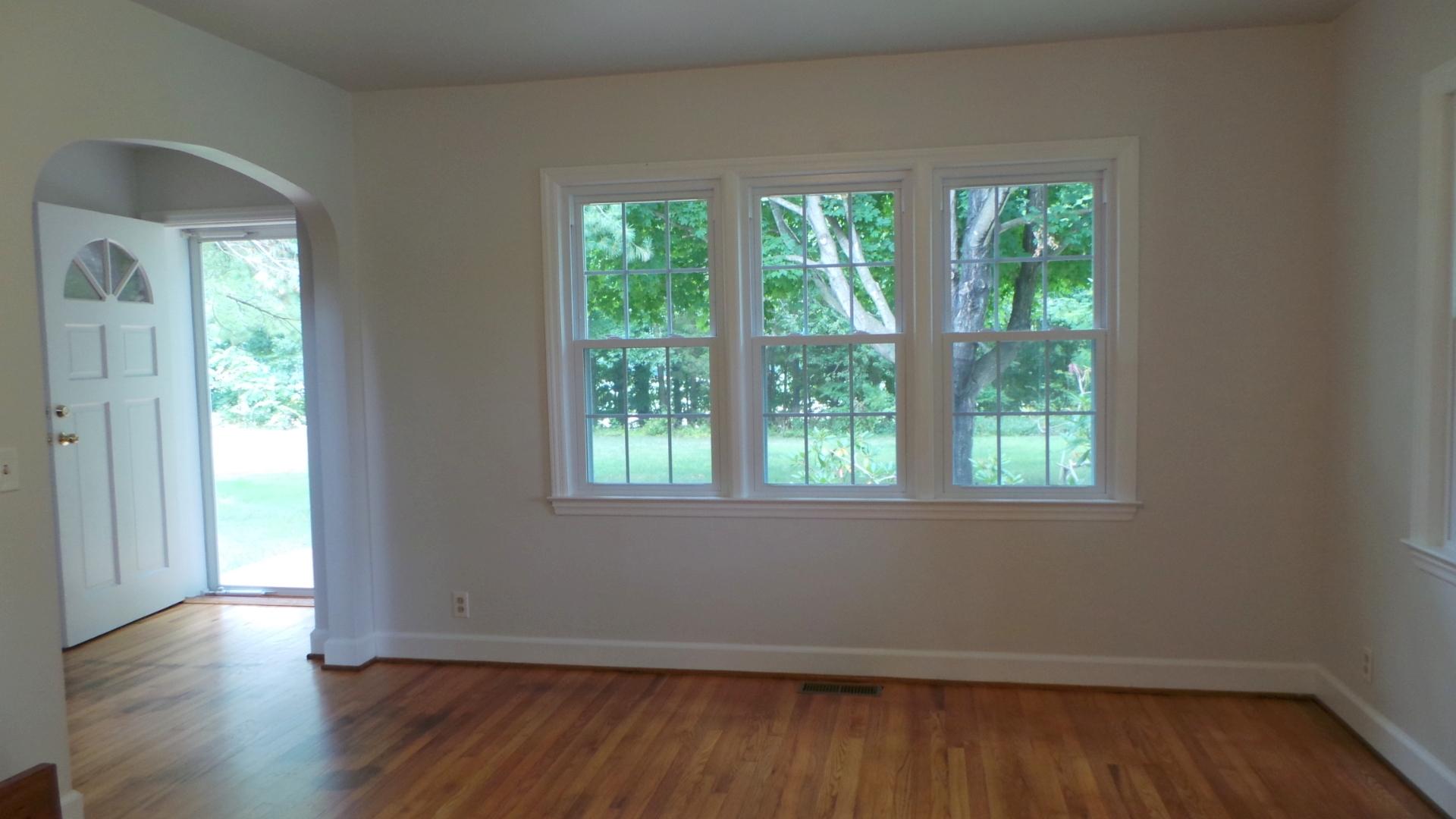 8659 Roanoke Road Elliston, VA 24087 - Photo 23 of 32 an empty room with wooden floor and windows