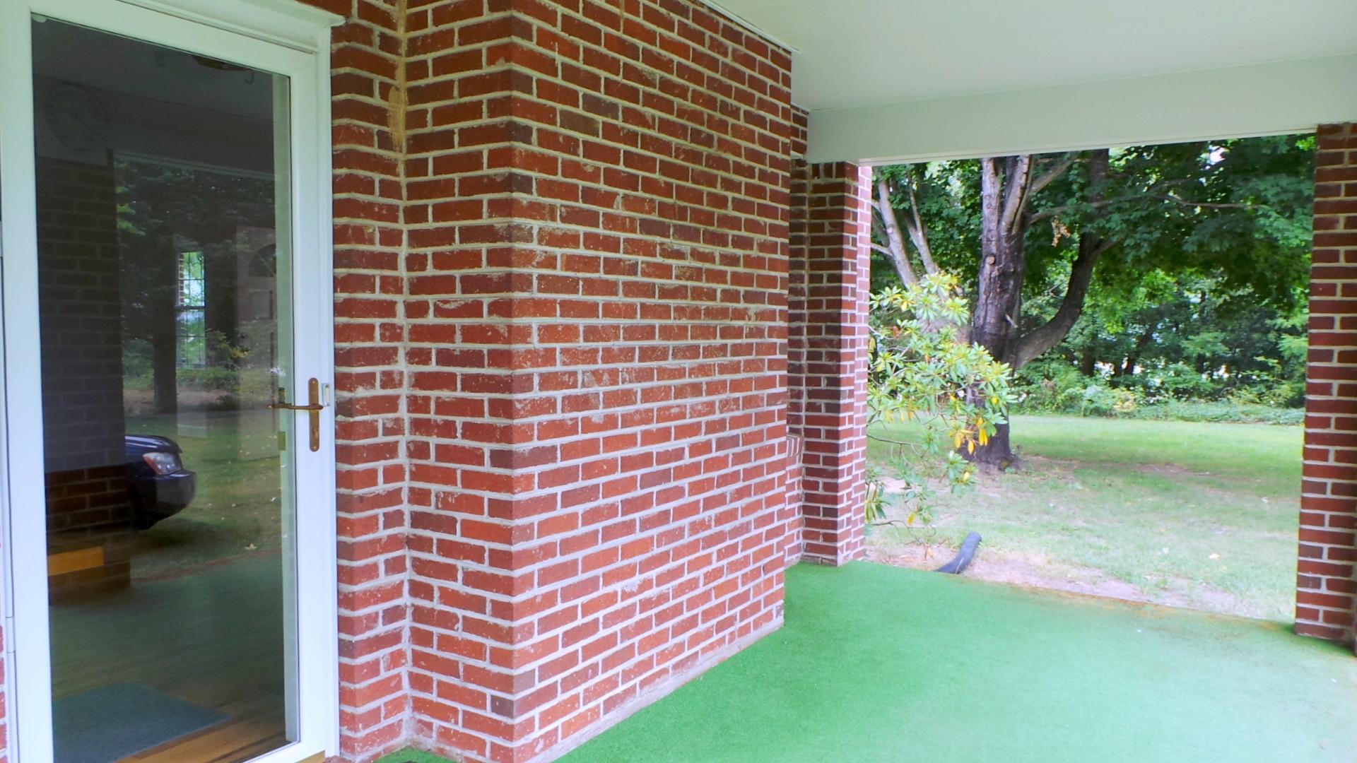 8659 Roanoke Road Elliston, VA 24087 - Photo 25 of 32 a brick building with a yard