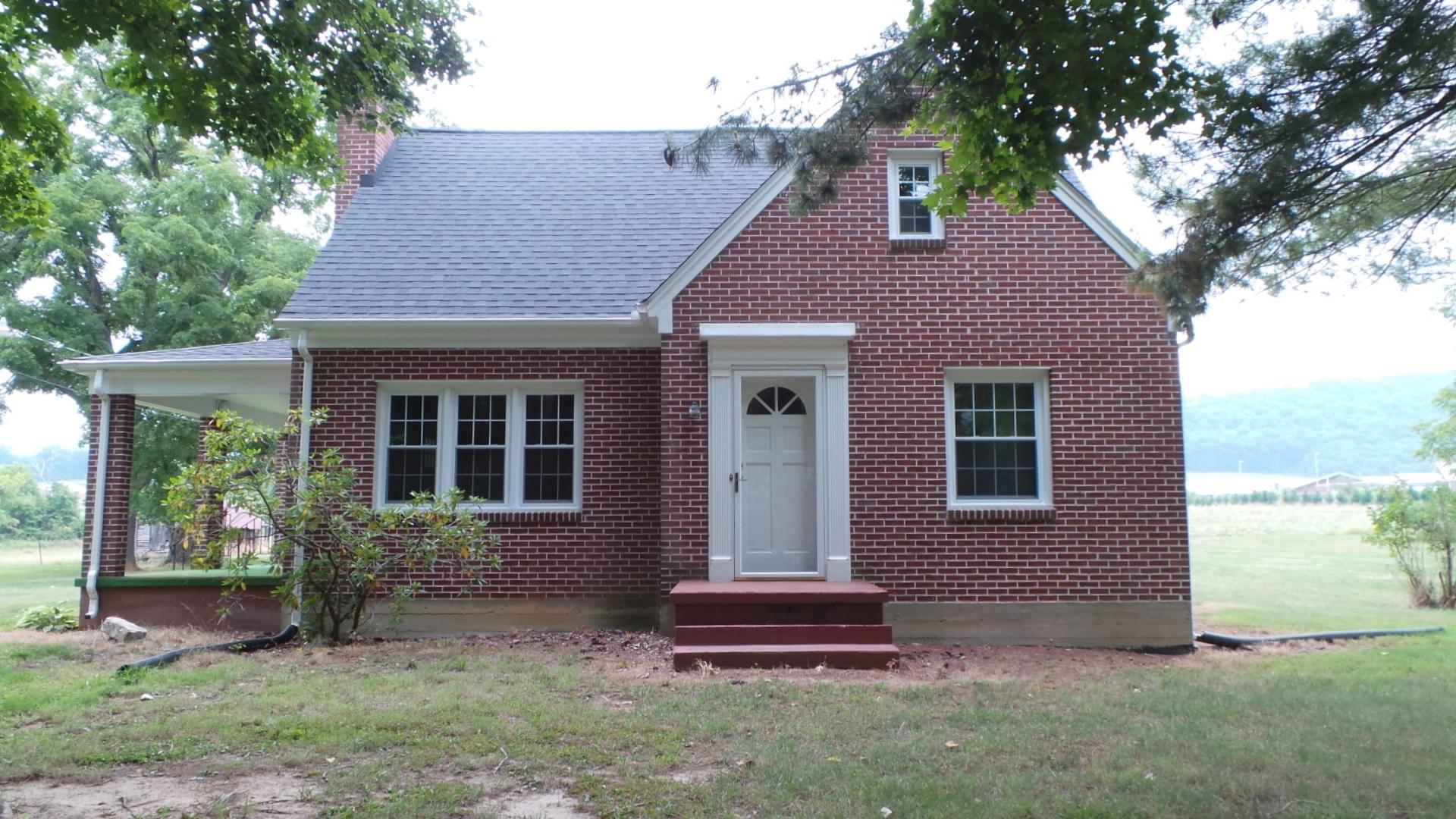 8659 Roanoke Road Elliston, VA 24087 - Photo 30 of 32 a front view of a house with garden